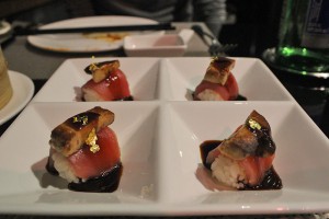 tuna sushi with foie gras and eel sauce, topped with gold flakes