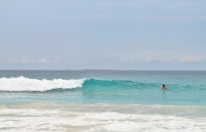 paddling out to surf in anguilla